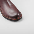 Load image into Gallery viewer, Close-up of Le Sansa Cayla chocolate boots showing the detailed leather texture and stylish design.