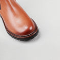 Load image into Gallery viewer, Close-up of Le Sansa Costa Brandy boots showing the stylish leather design and detailed stitching.