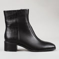 Load image into Gallery viewer, Black Le Sansa Sansa Spike boots with textured design and ankle height, featuring spike details and a sleek, modern style.