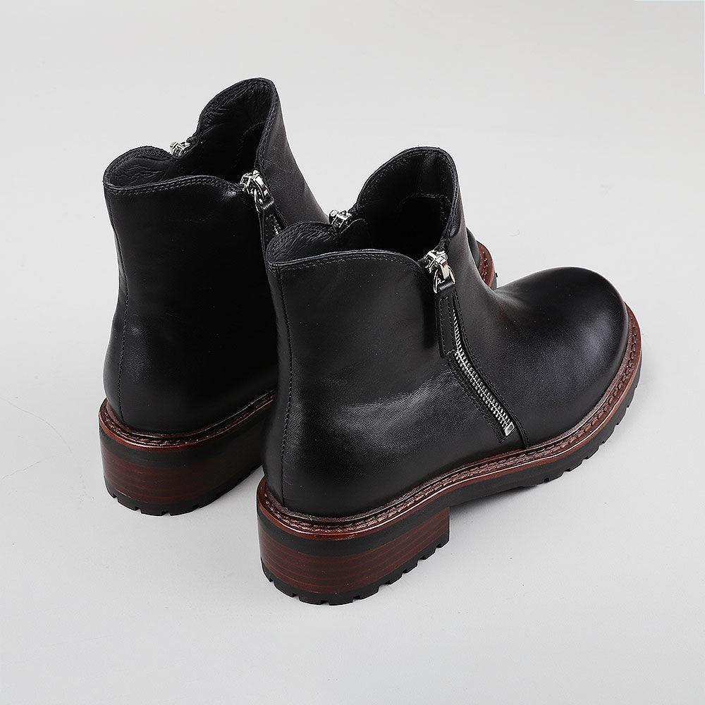 Black LE SANSA Cayla boots by Le Sansa, featuring a sleek design, pointed toe, and stylish ankle height.