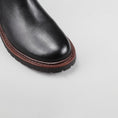 Load image into Gallery viewer, Close-up of Le Sansa Cayla black boots showing sleek leather material and stylish ankle design.
