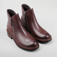 Load image into Gallery viewer, Pair of Le Sansa Cayla chocolate boots showing their stylish design and brown leather material.
