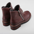 Load image into Gallery viewer, Pair of Le Sansa Cayla chocolate boots with back view, showcasing stylish design and rich brown color.
