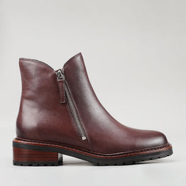 Le Sansa Cayla chocolate boots showing side view with sleek design and dark brown color, perfect for stylish footwear.