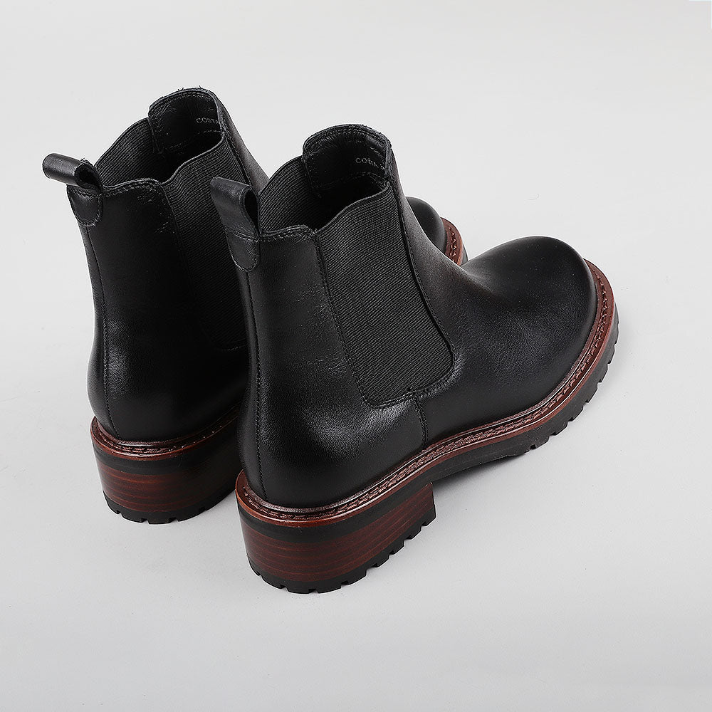 Le Sansa Costa black boots showing the back view with sleek design and sturdy heel.
