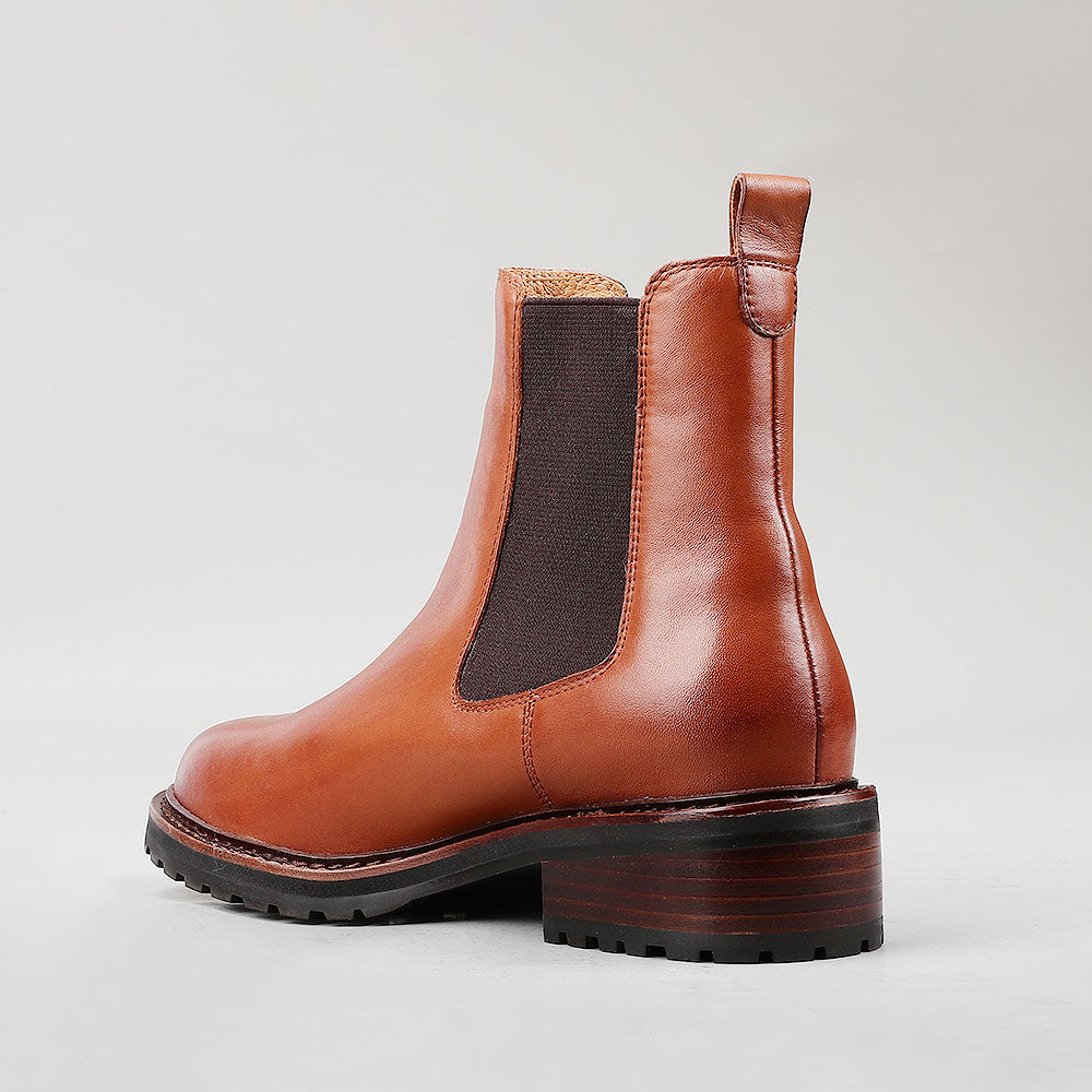 Le Sansa Costa Brandy boots with stylish design and leather construction, showcased in a close-up image.