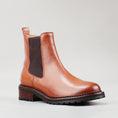 Load image into Gallery viewer, Le Sansa Costa brandy boots featuring dark leather and stylish stitching, displayed on a neutral background.

