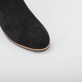 Load image into Gallery viewer, Close-up of Naked Arches Oxley black suede boots showing sleek design and smooth texture.
