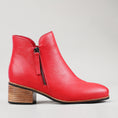 Load image into Gallery viewer, Naked Arches Oxley Red boots with a sleek design and vibrant red color, shown from the side view.
