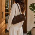 Load image into Gallery viewer, Brown Second Nature handbag with sleek design and top handle, featuring a spacious interior and subtle branding.
